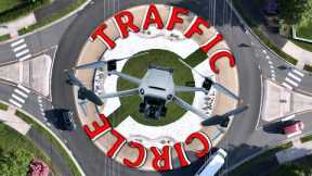 drone rotating with cars in a traffic circle