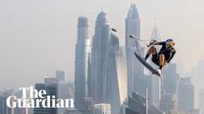 Daredevil wakeskates across rooftop pool and base jumps off the edge in Dubai